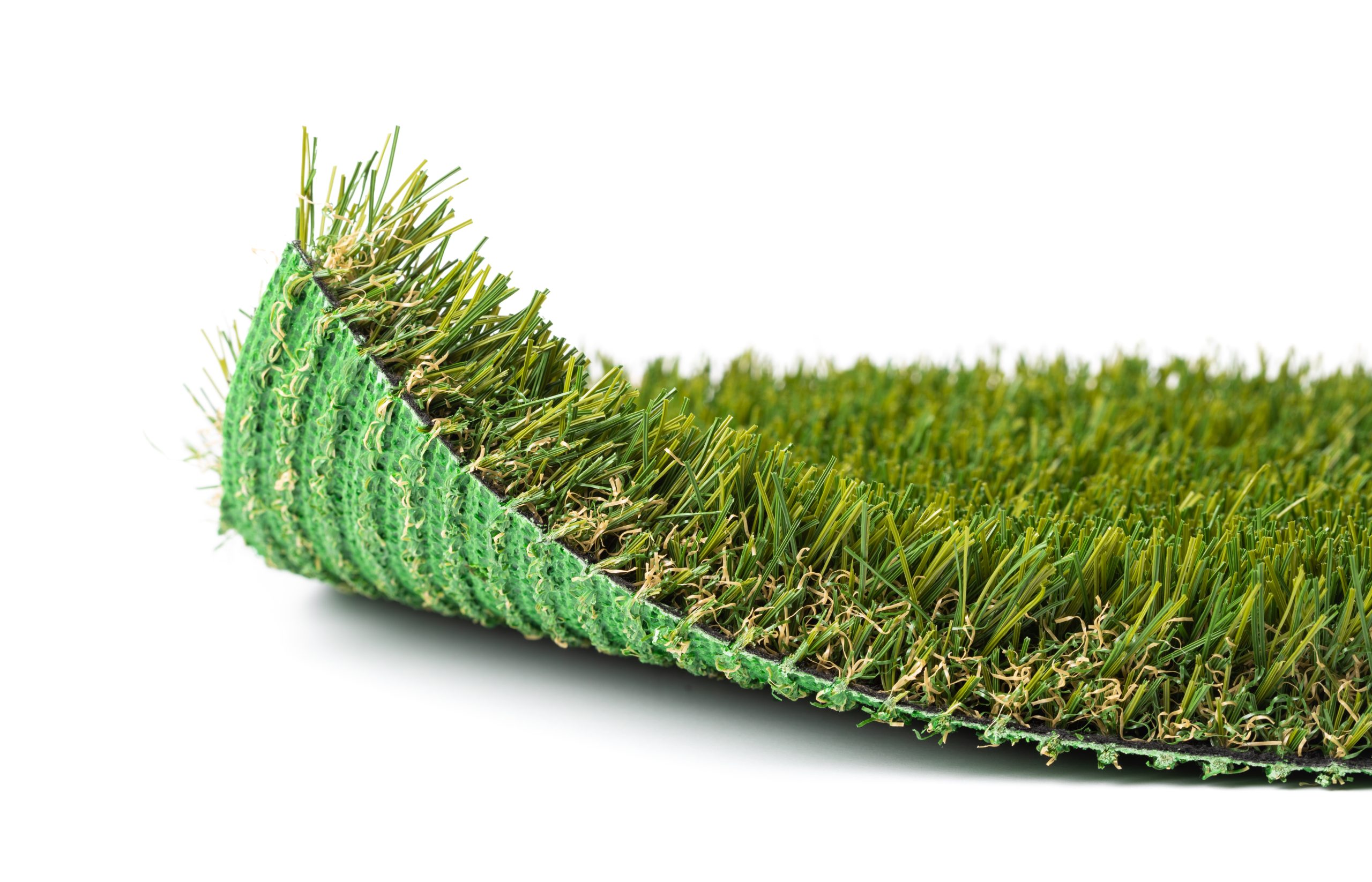 Flipped Up Section of Artificial Turf Grass On White Background.